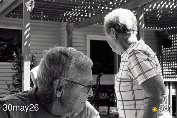 Black and white film photo of my mom and dad