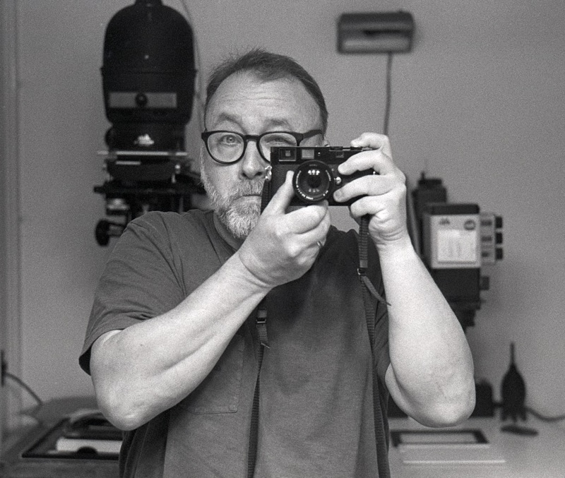 Black and white film self-portrait with Leica MP in mirror