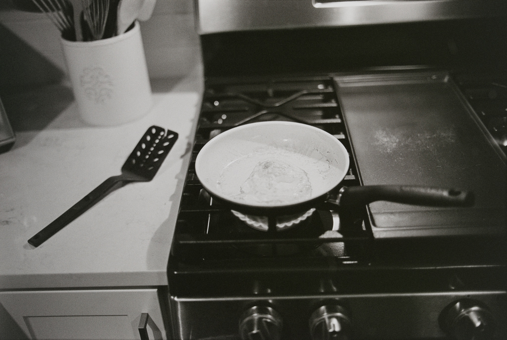 Black and white photo of pan on stove