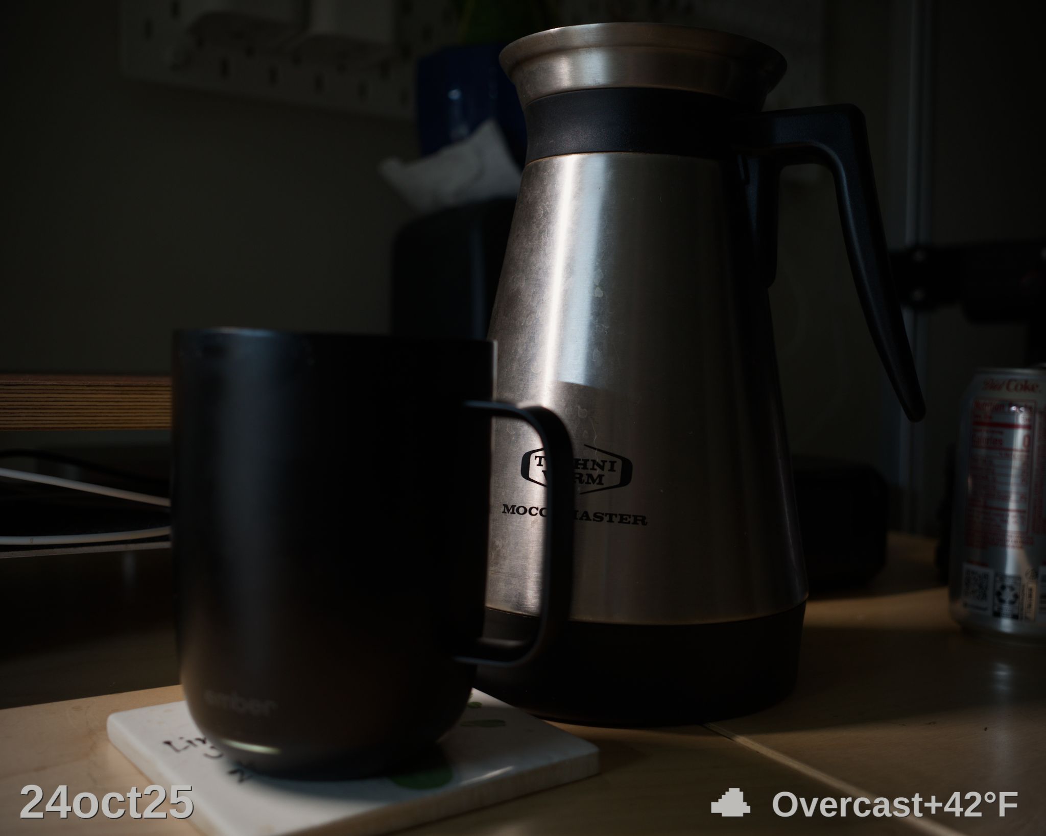 Coffee pot and cup on desk