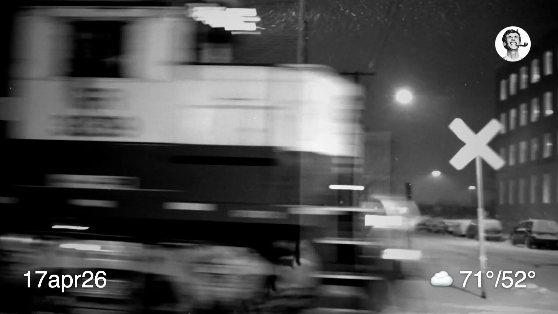 Blurry black and white photo of a train passing by