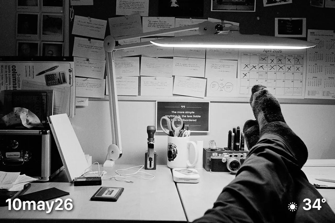 Black and white film photo of my desk