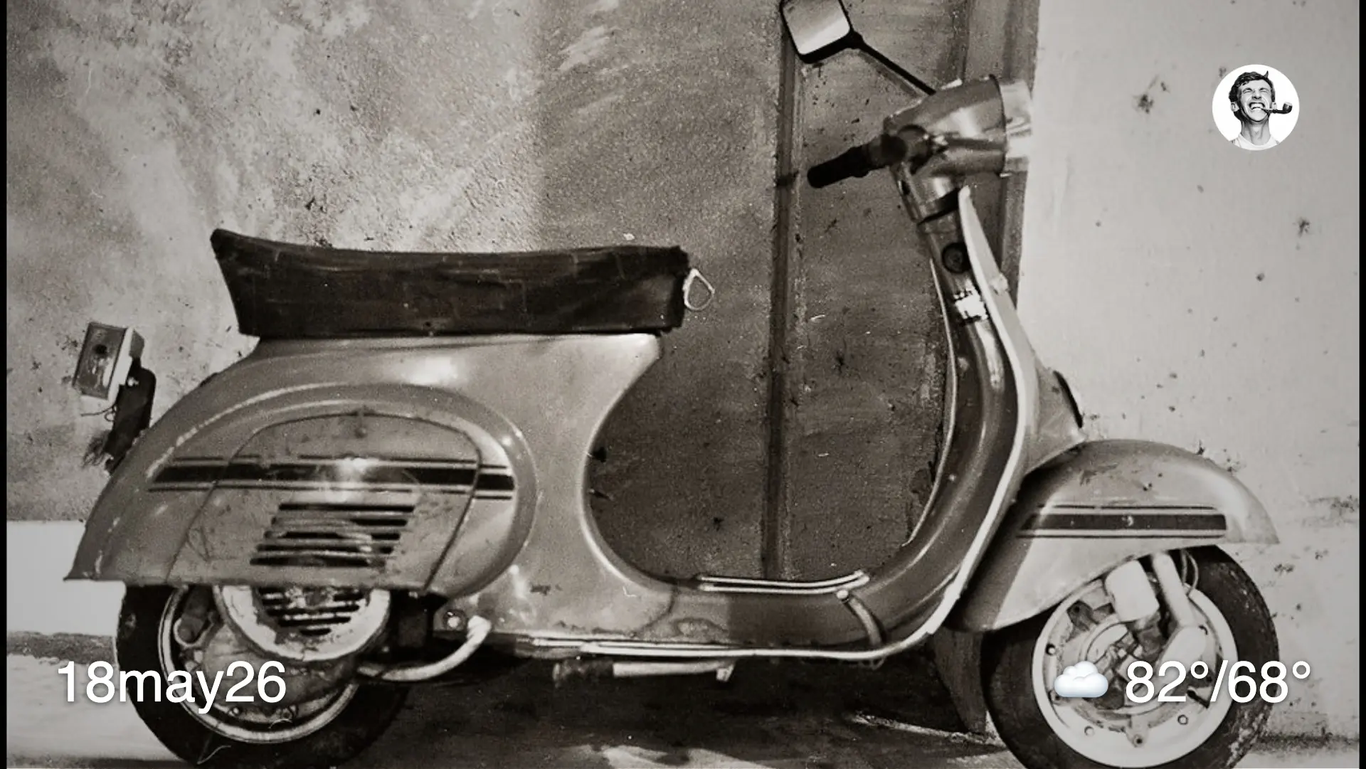 Black and white film photo of a scooter