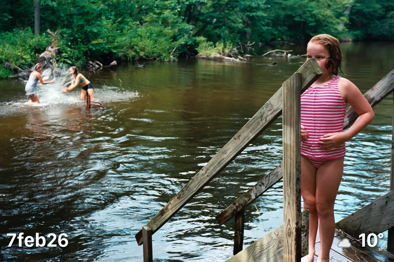 Kids in river and on small dock