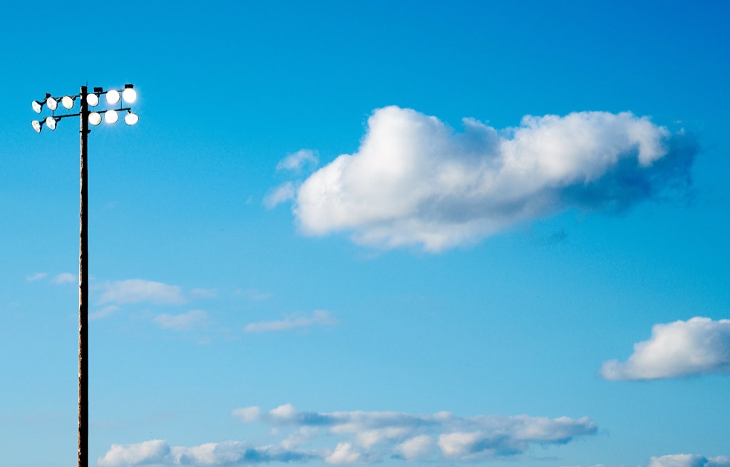 Light pole and sky with clouds