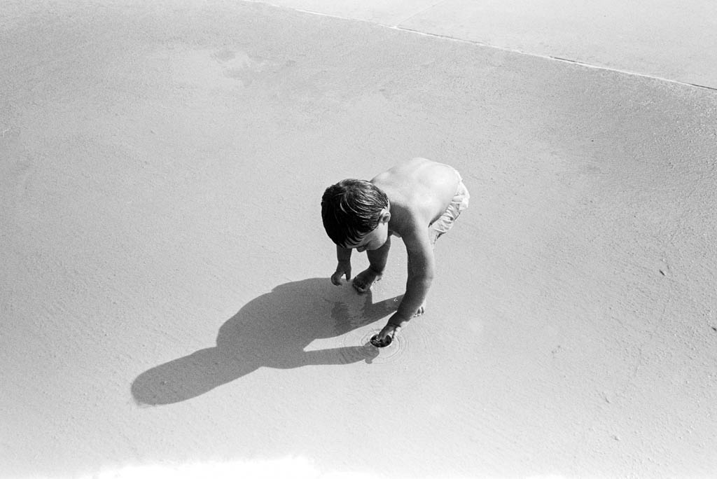 Black and white film photo of toddler