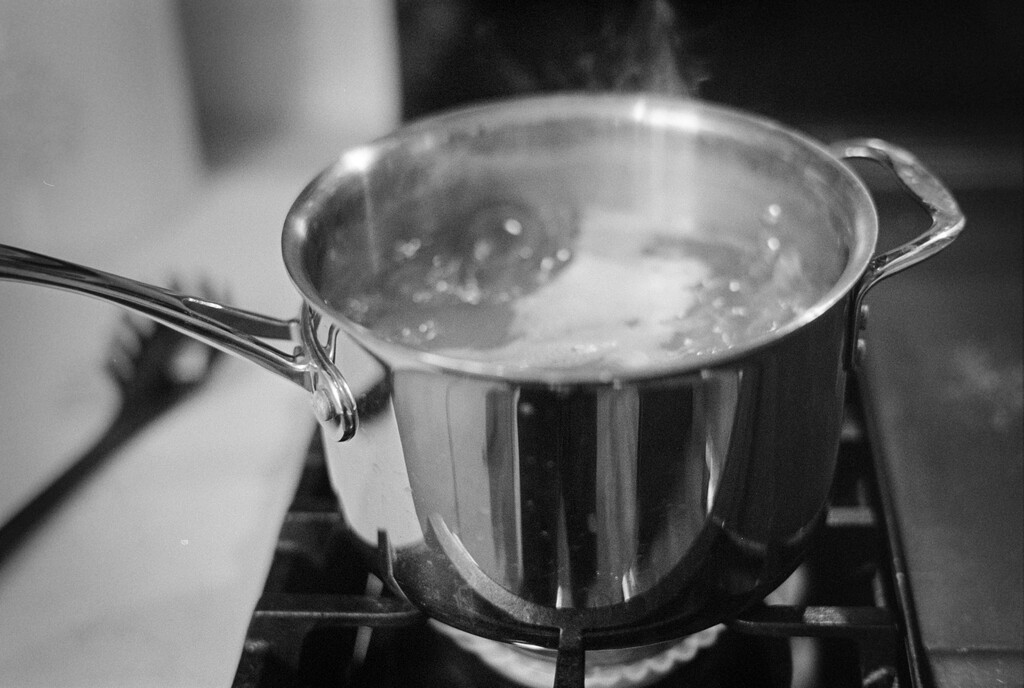 Pot of water boiling on stove