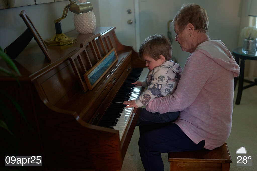 My mom and grandson playing piano