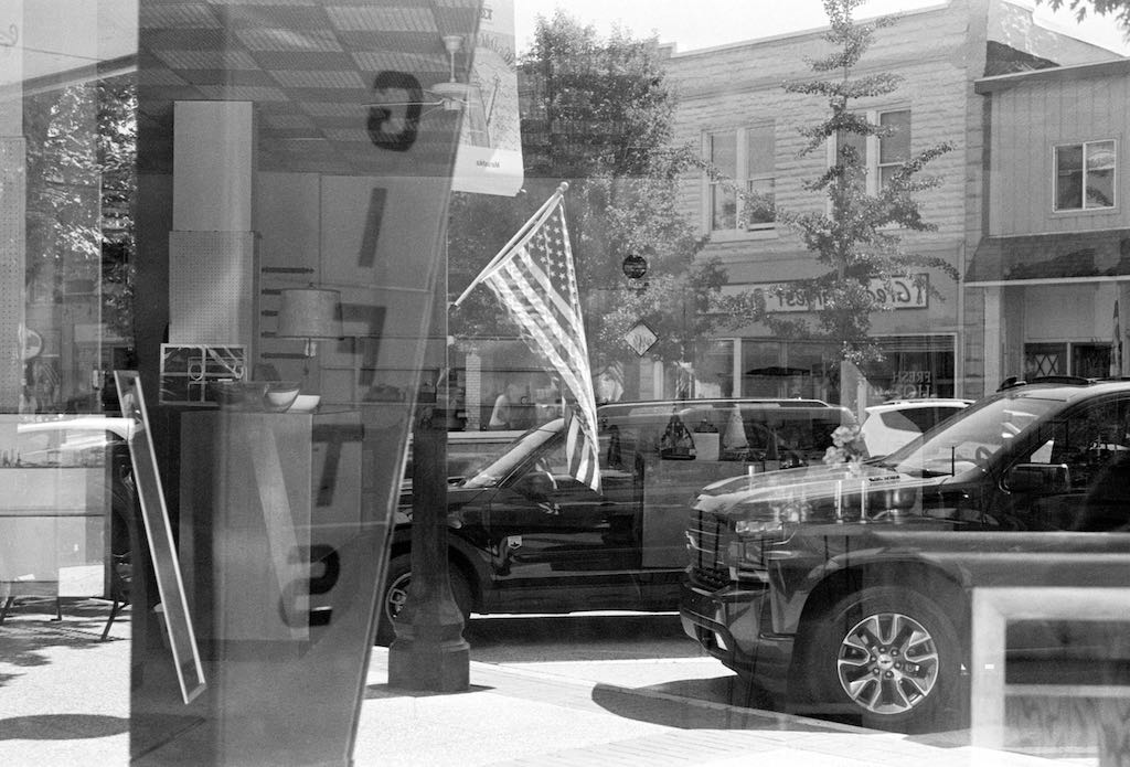 Reflection in store front. Grand Haven, MI (2024)