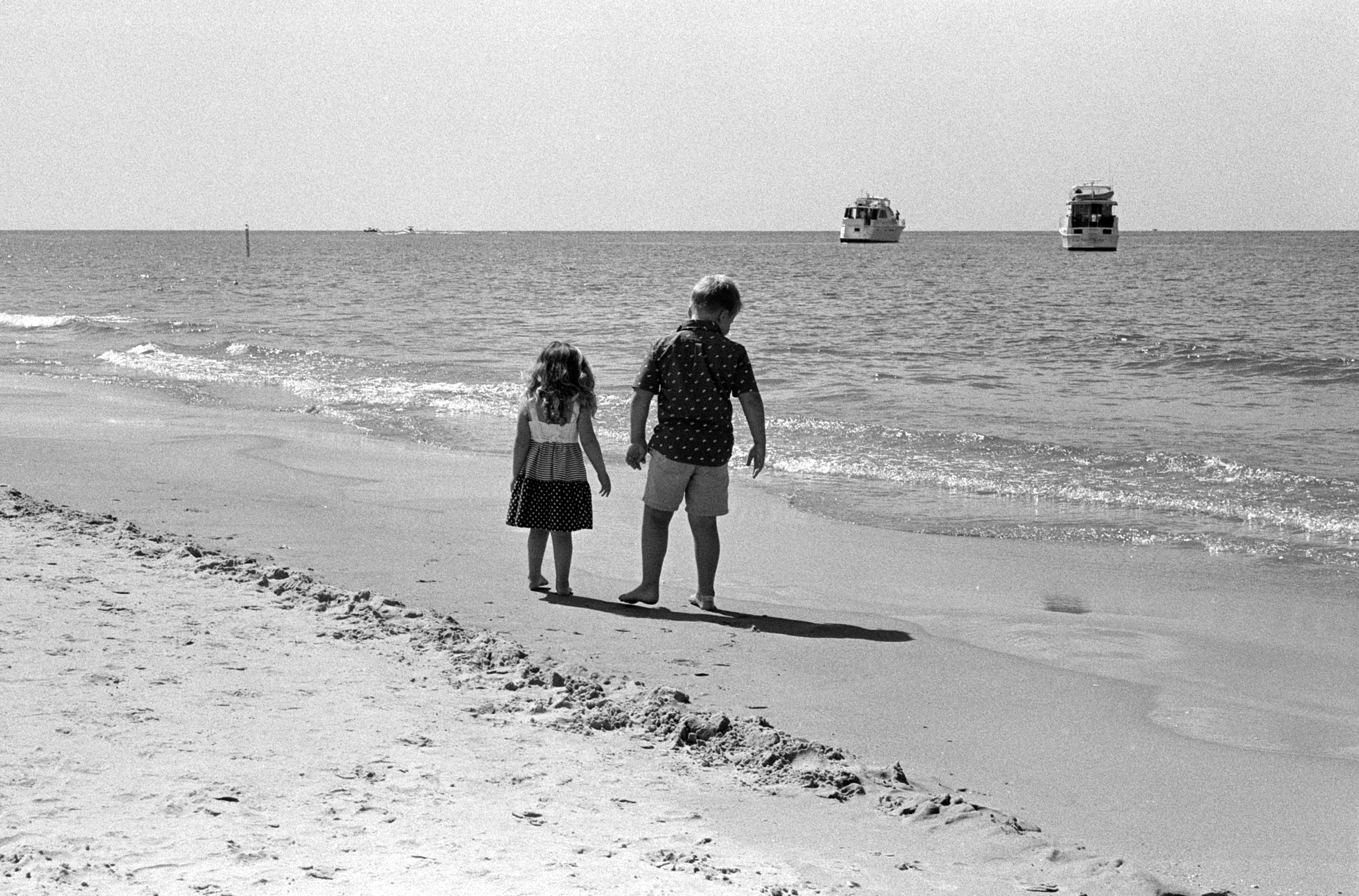 Well-dressed kids on beach