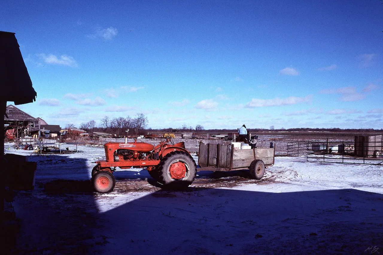 Red tractor in field